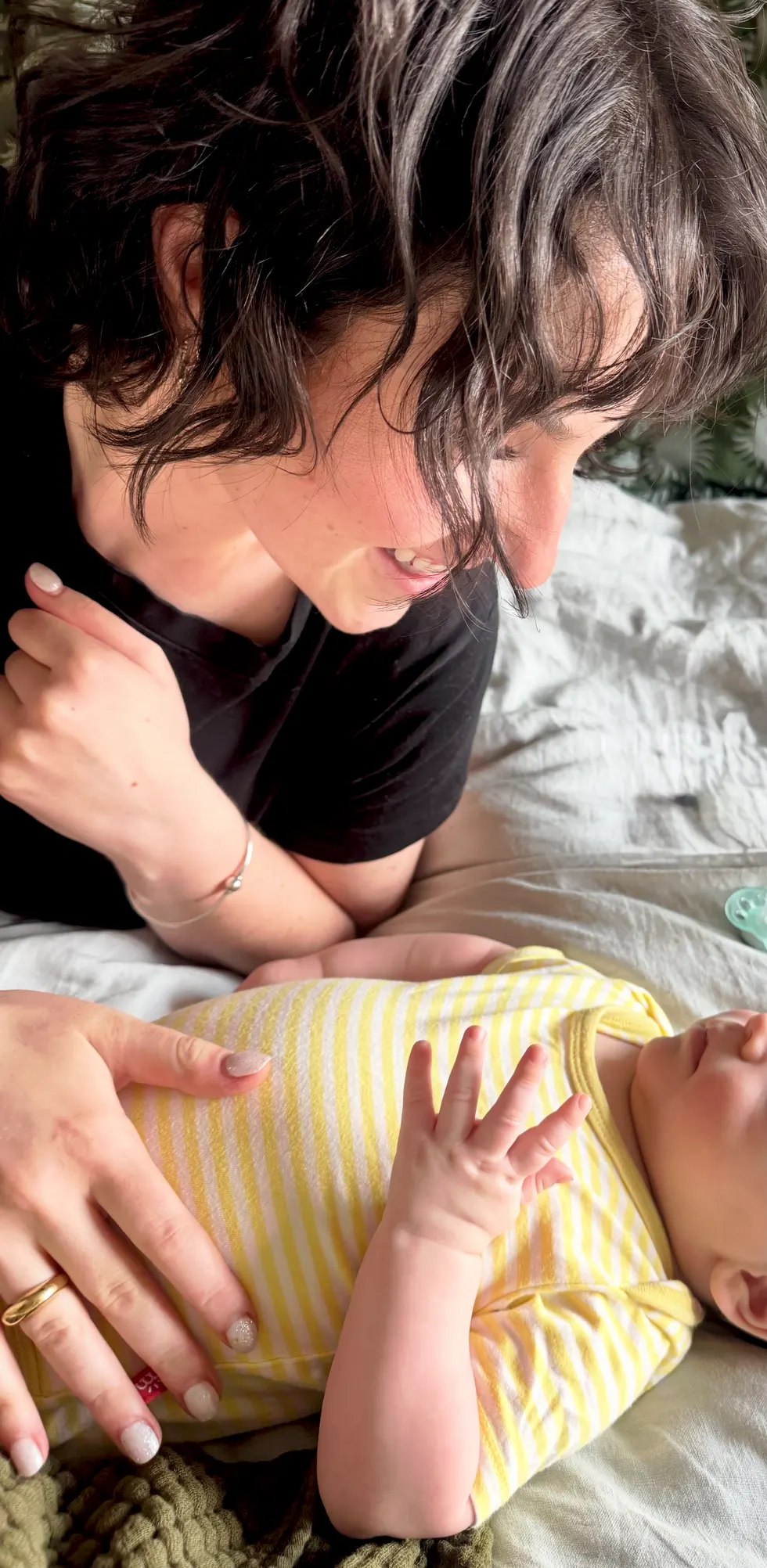 Becca sharing a quiet moment with a newborn